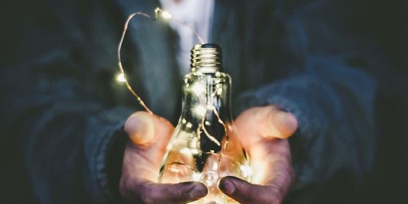 Man holding a light bulb